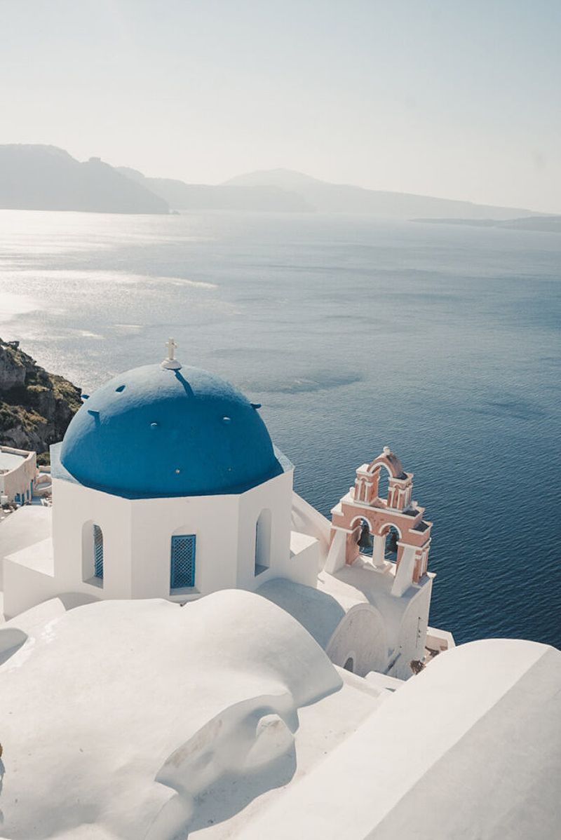 Santorini's iconic white-washed buildings against the azure sea