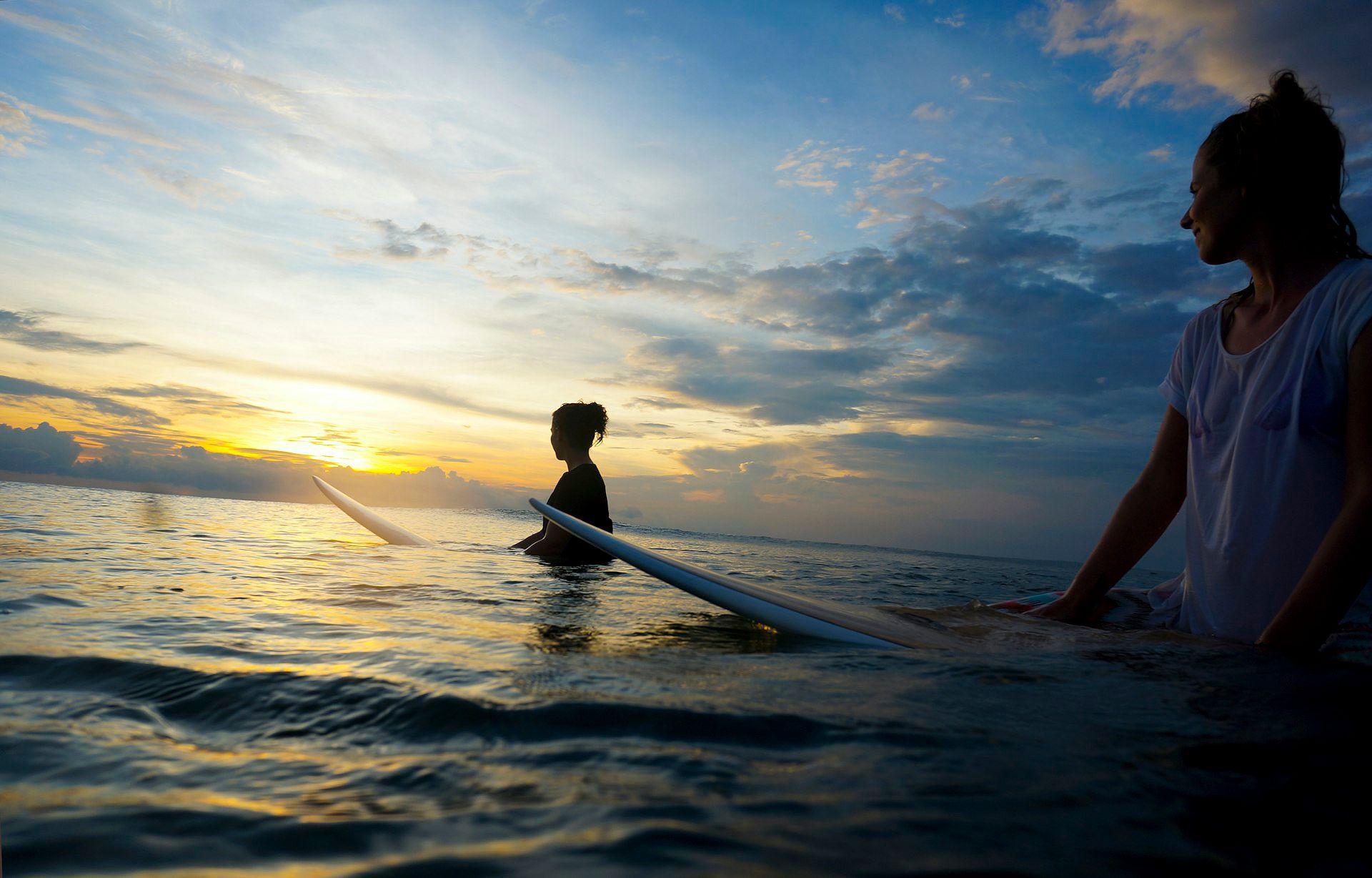 Surfers enjoying the waves in Canggu, Bali