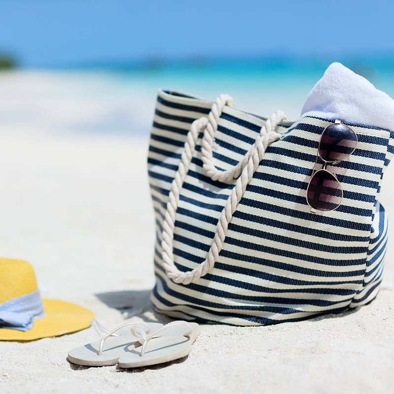 Tropical beach with sunbathing essentials